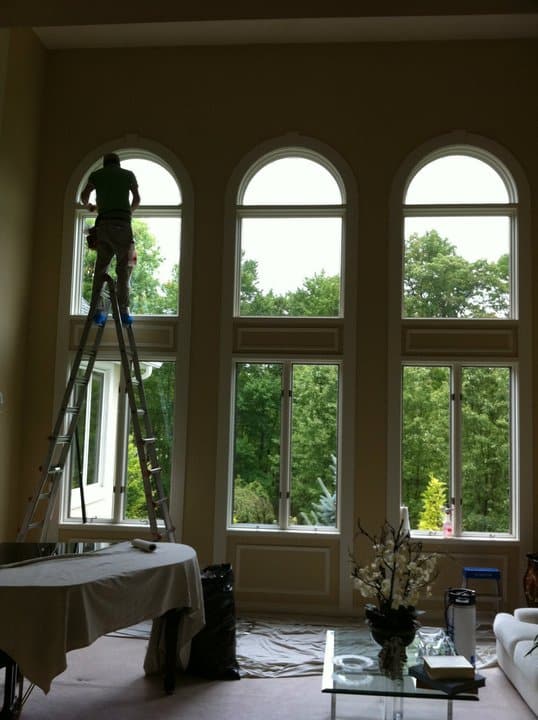 Sun Control Specialists installing window film in a southeastern Pennsylvania home